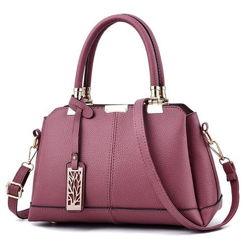 Damen-Handtaschen aus Leder mit Ästen aus Metall