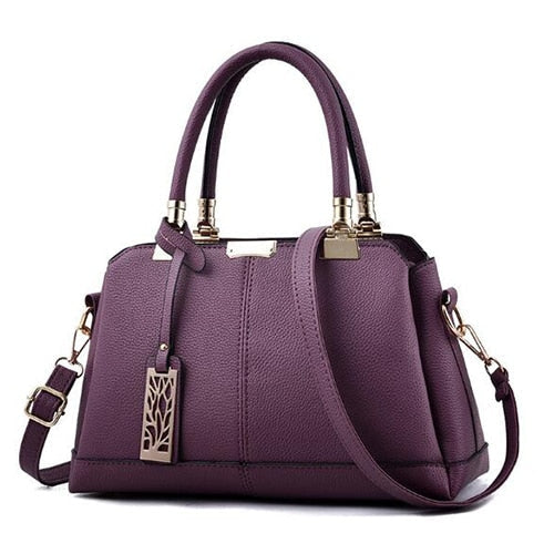 Damen-Handtaschen aus Leder mit Ästen aus Metall
