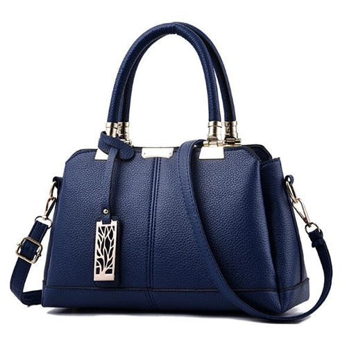 Damen-Handtaschen aus Leder mit Ästen aus Metall